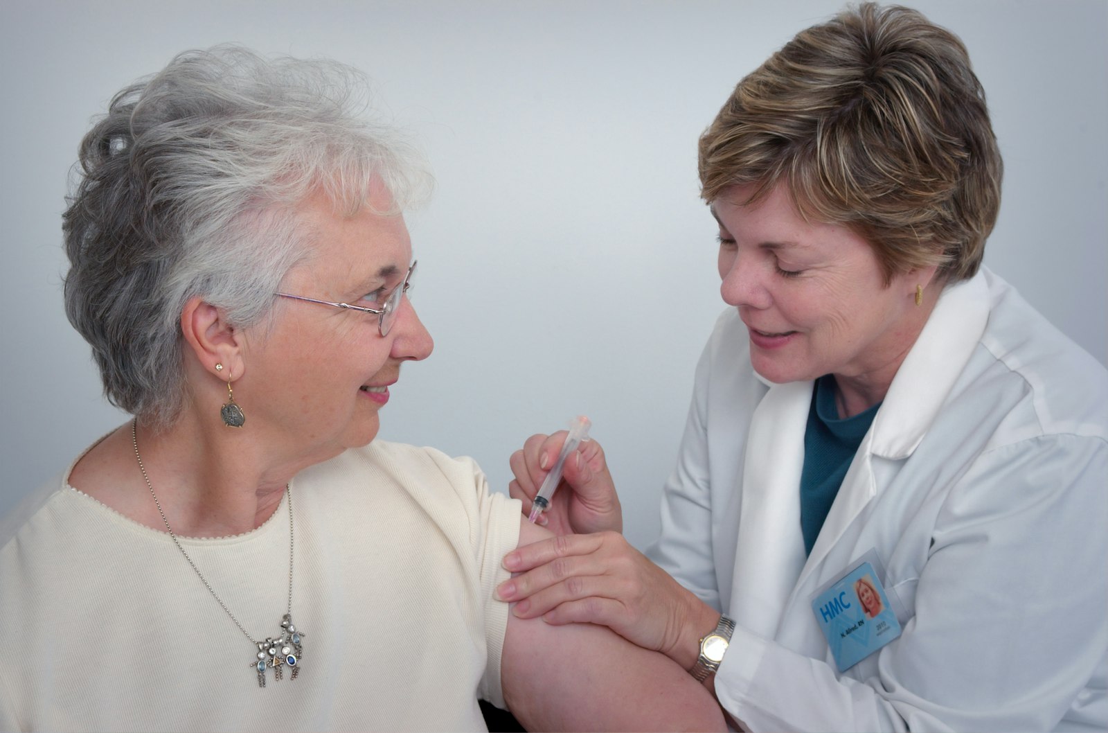 A caregiver sharing a warm moment with an elderly patient