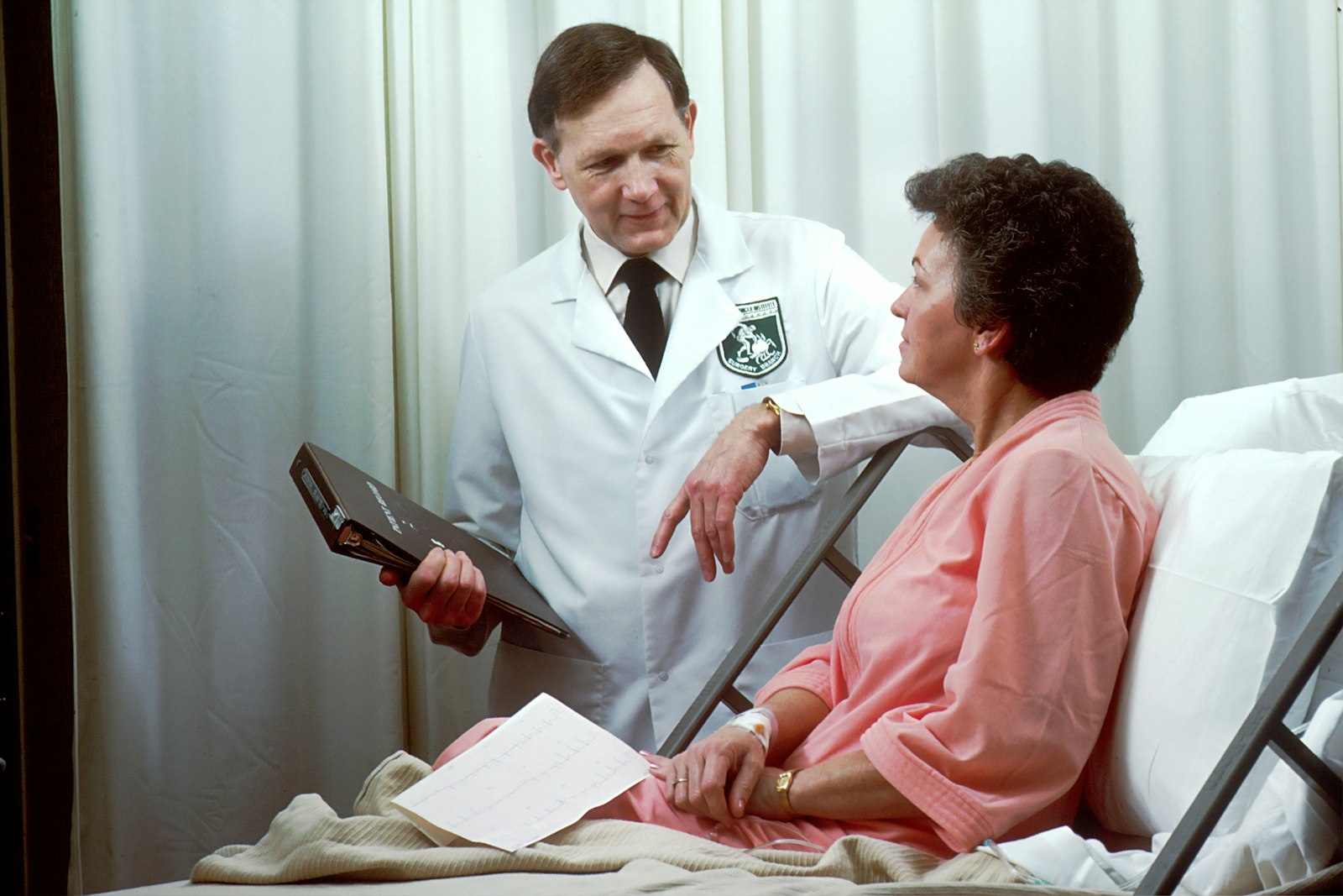 A physician reviewing a treatment plan with a patient